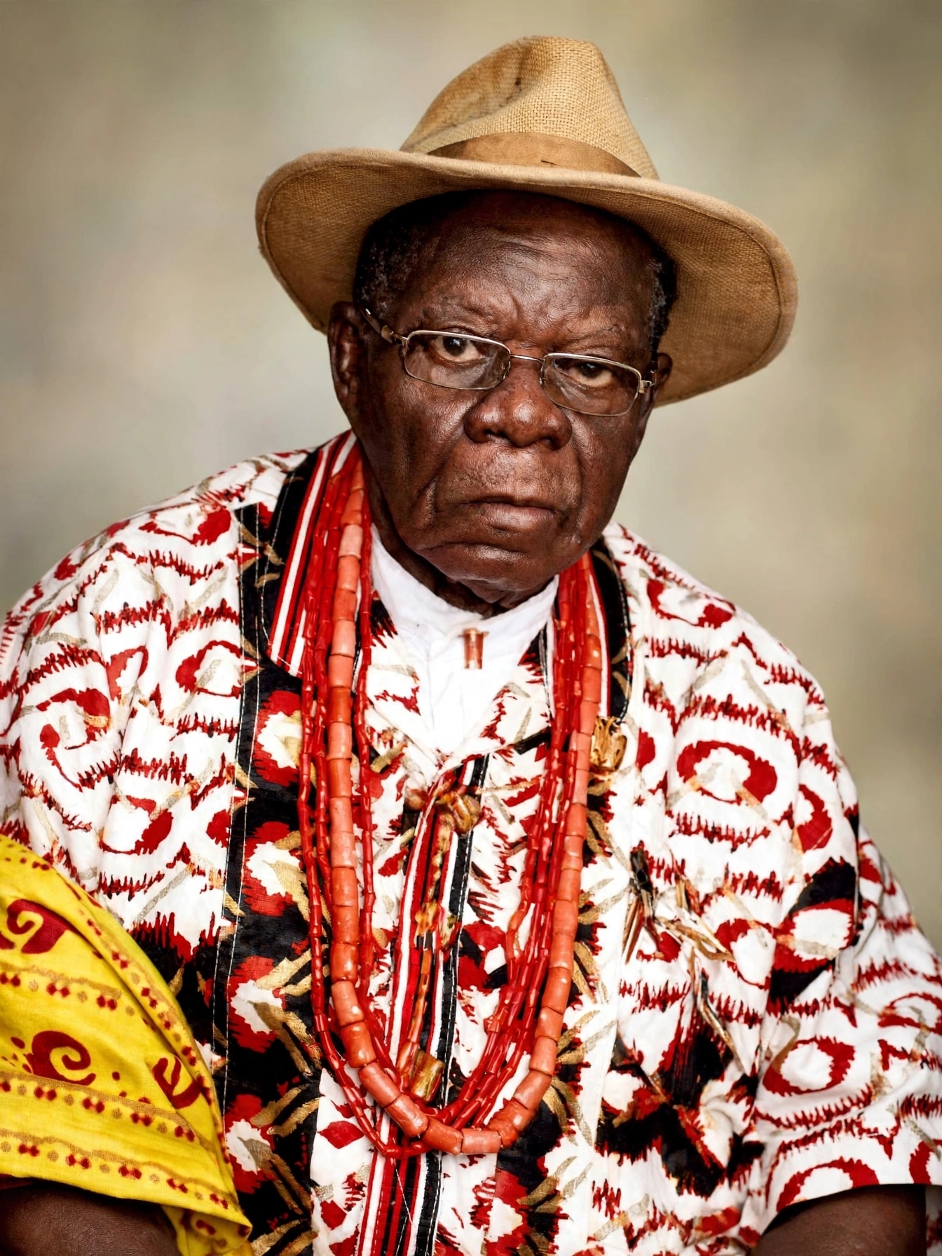 Late Chief Hans Suku-Ogbari Ogbari XII in red traditional Ijaw attire with black bow tie and white pom-pom cap, University of Lagos Electrical Engineering graduate