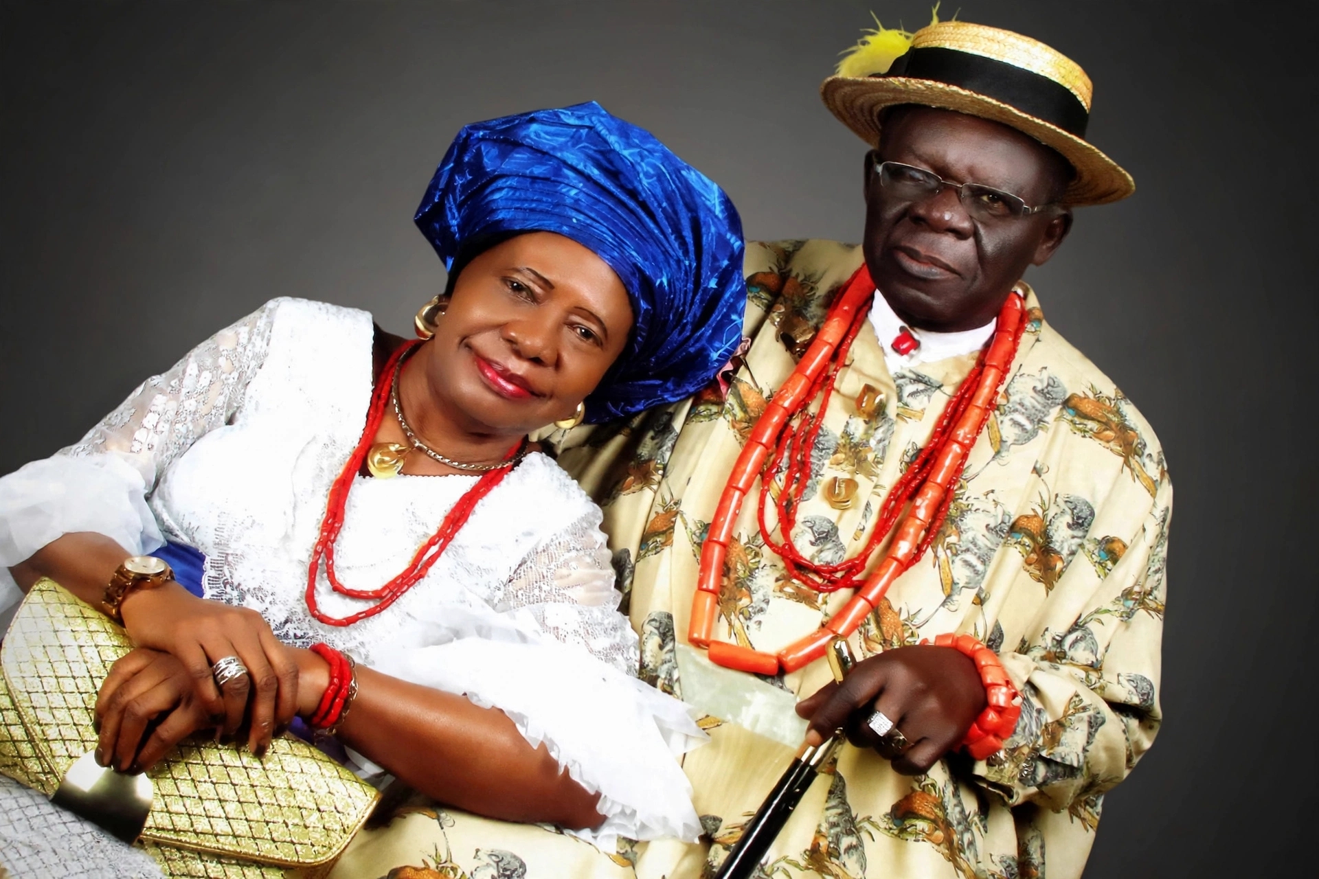  Late Sir Hans Suku-Ogbari JP Ogbari XII and his wife in traditional attire, blue gele and coral beads, official couple portrait from funeral biography booklet